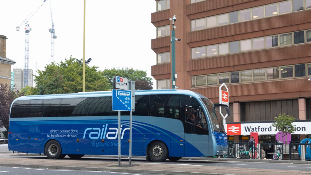 Image of RailAir bus service RA3 travelling from Heathrow to Watford, outside of Watford Junction Station